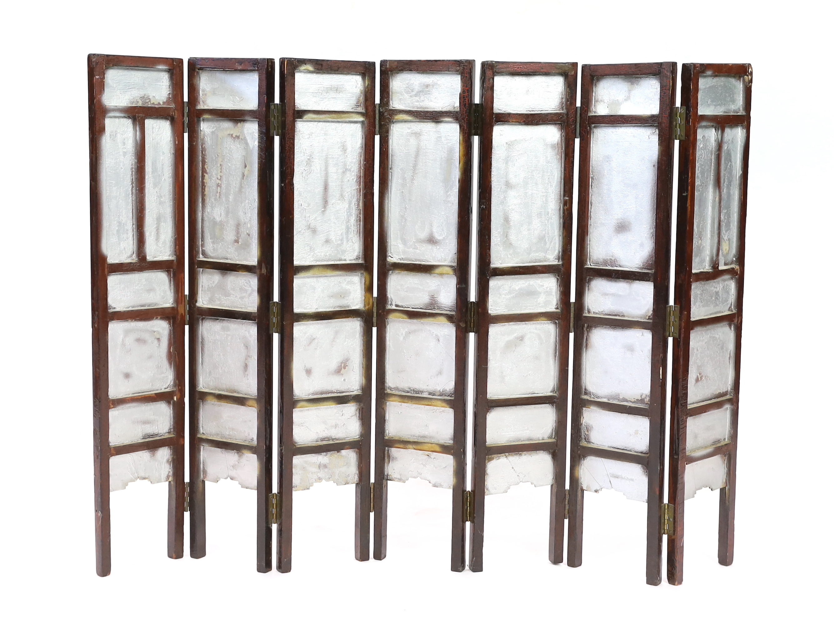 A Chinese blue and white panelled seven-fold low screen, late 19th/early 20th century, some cracked panels